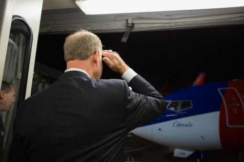 Southwest Airlines CEO Gary Kelly salutes the captain of the first non-stop flight out of Dallas Love Field. The Wright Amendment ended on Monday, Oct. 13 2014, allowing non-stop flights to anywhere in the U.S. from Dallas Love Field. / Stephen M. Keller, 2014