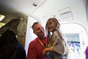 Southwest Airlines sends a plane full of chronically ill children and their families to Disney World during the annual Kidds Kids event. // Stephen M. Keller