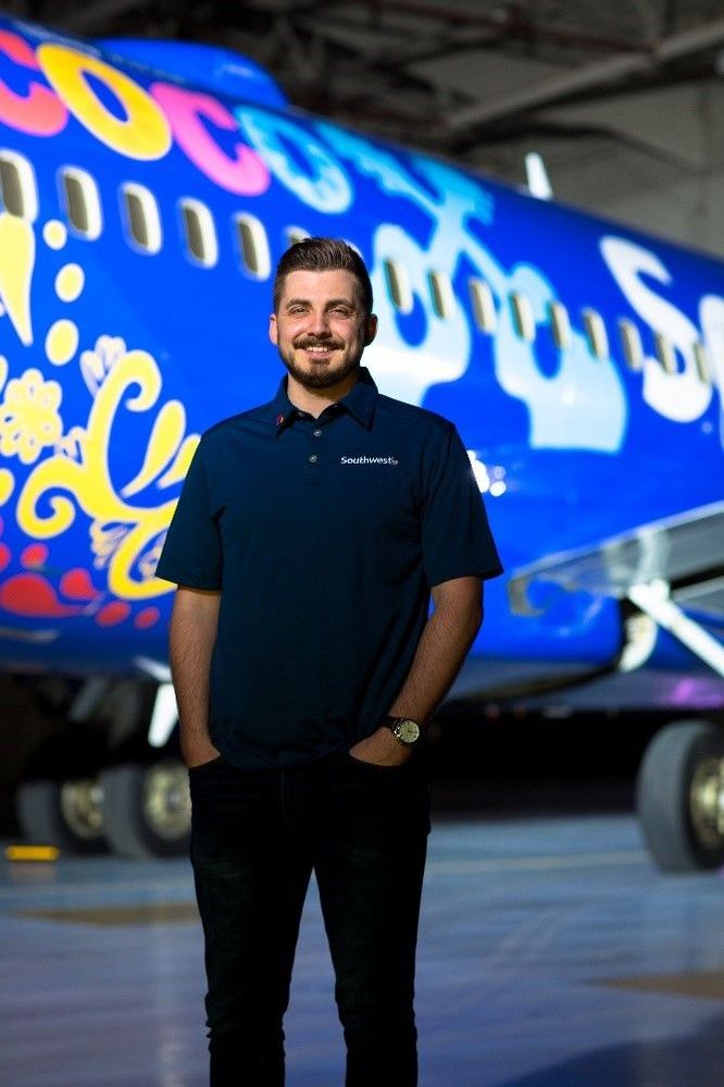 Me in front of the Disney Pixar “Coco”-Themed Aircraft I designed in 2017