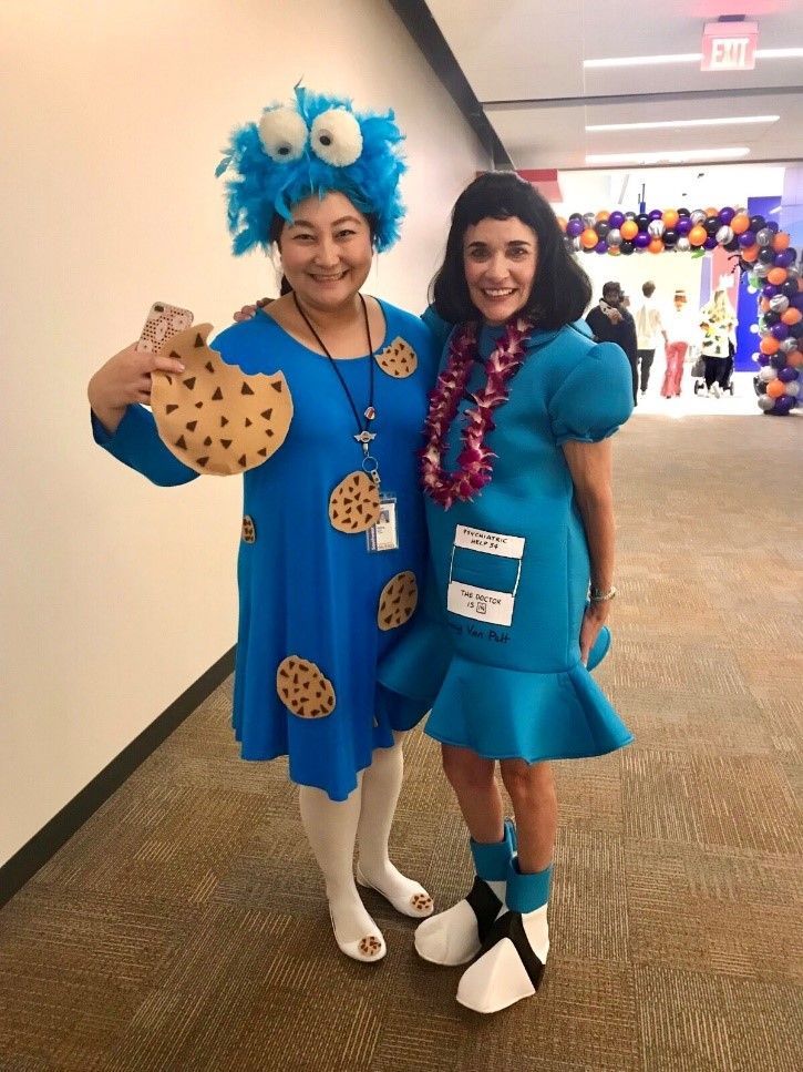 Me (left) dressed as Cookie Monster celebrating Halloween 2019 with CFO Tammy Romo (right) dressed as Lucy from Peanuts