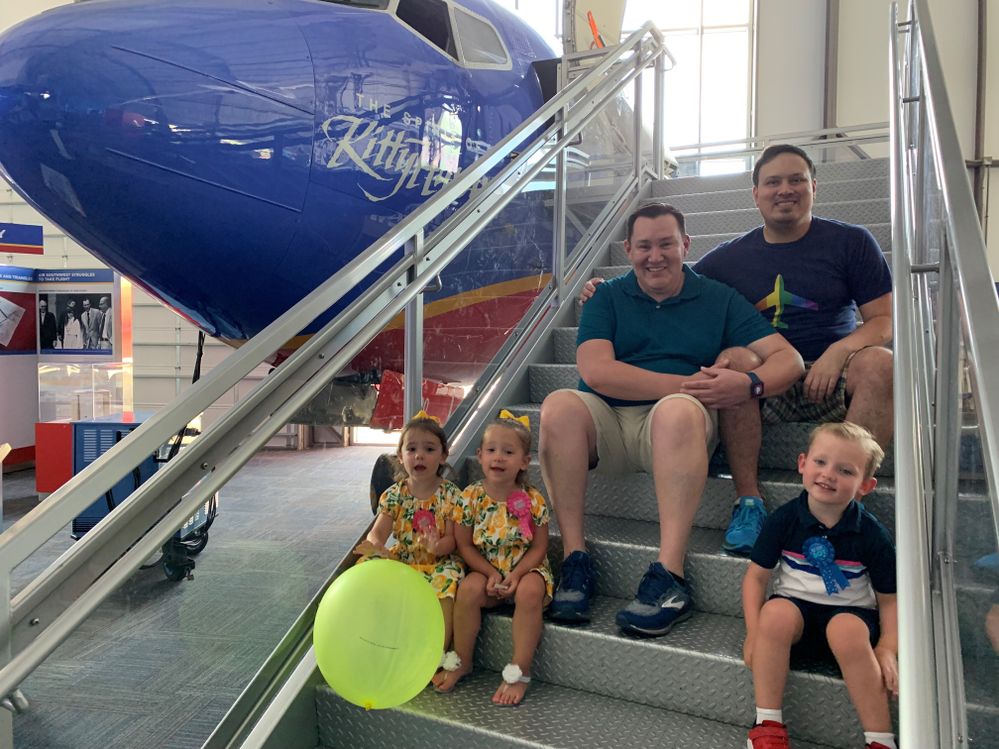 Victor at the Frontiers of Flight Museum with his partner and his nieces and nephew