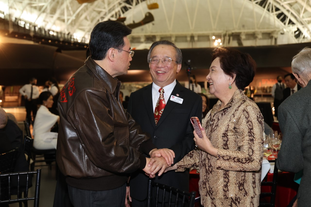 Henry Yin, Chair of the APAPA National Governing Board, speaking with Ambassador Qin Gang.