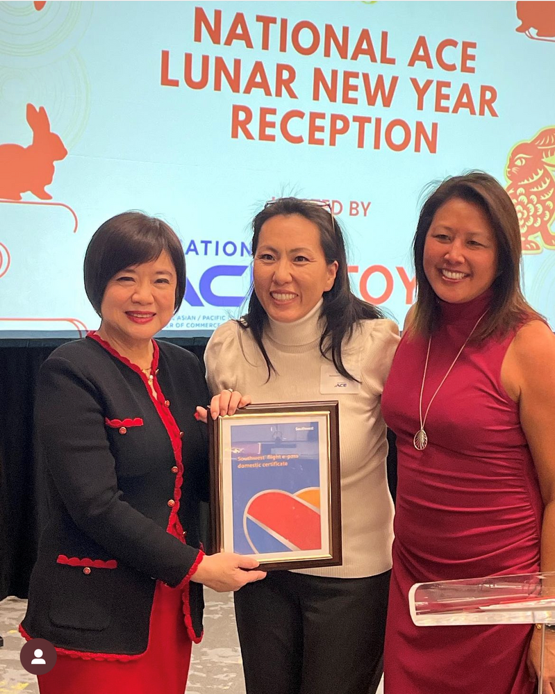 Group of women receiving Southwest Airlines sponsorship plaque at the National Ace Lunar New Year Reception.
