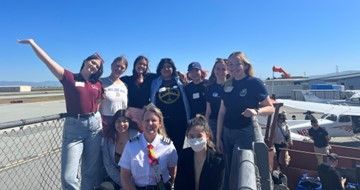 Southwest Airlines First Officer Wendy HM. (first row, center) with members of the WAI San Jose State University Chapter at a Girls in Aviation Day event in San Jose, Calif.