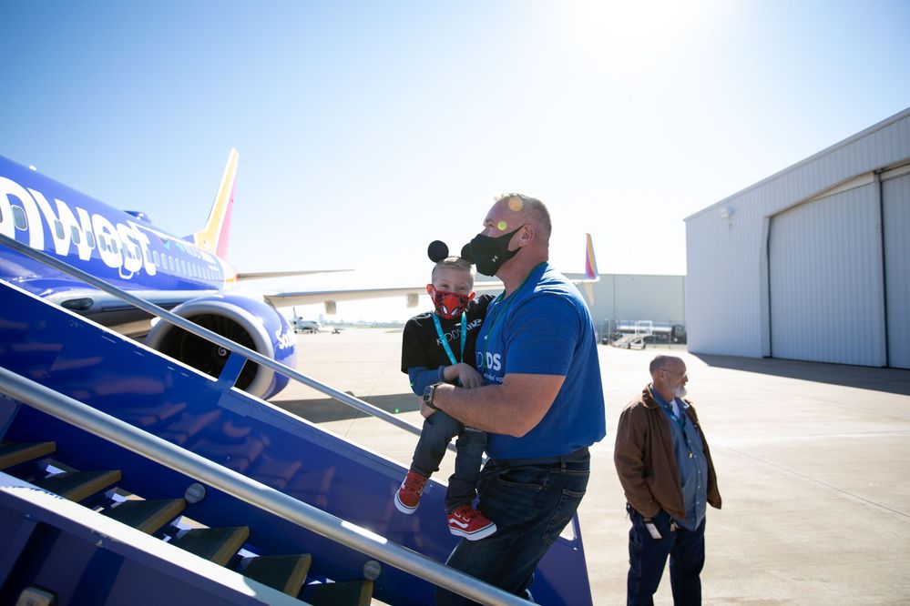 A child selected to go on the Kidd’s Kids trip boards a Southwest Airlines charter aircraft.
