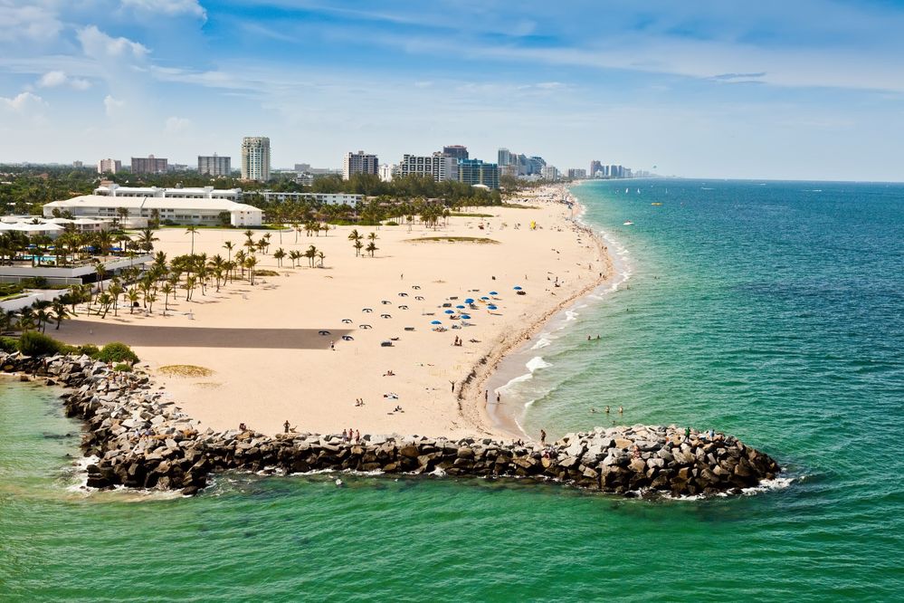 Long stretch of Ft Lauderdale Beach in Florida with sandy beaches and numerous hotels and resorts