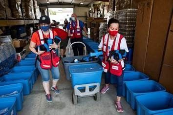 American Red Cross volunteers on Aug. 11, 2021, gathering supplies to deliver to the areas most affected by the Dixie and River wildfires in California