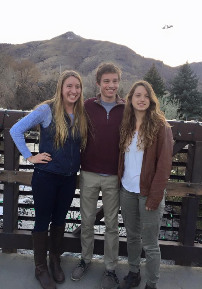 Katie, his sister, (left), Mitchell (center), and Christi, his other sister, (right) in Boulder, Colorado.